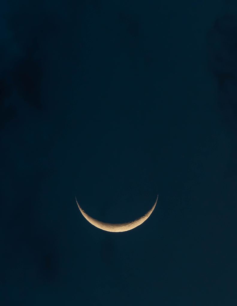 Photo of a waning moon in night sky