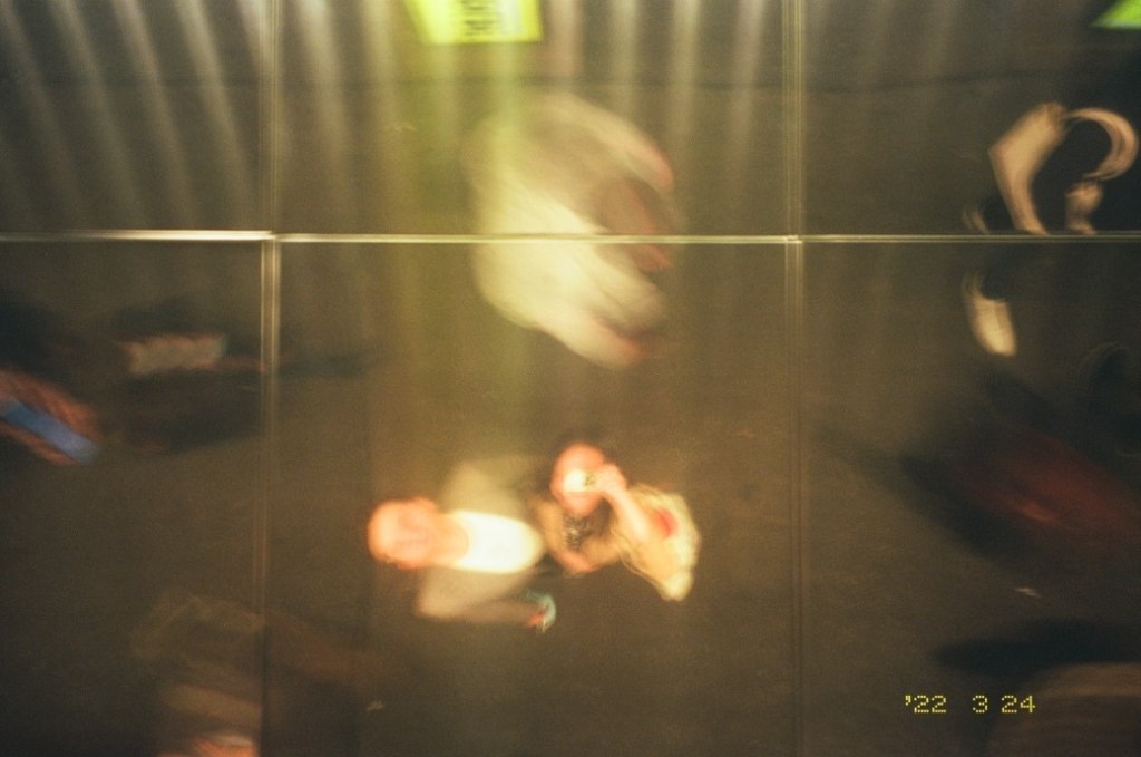 a couple taking a picture of their refleciton