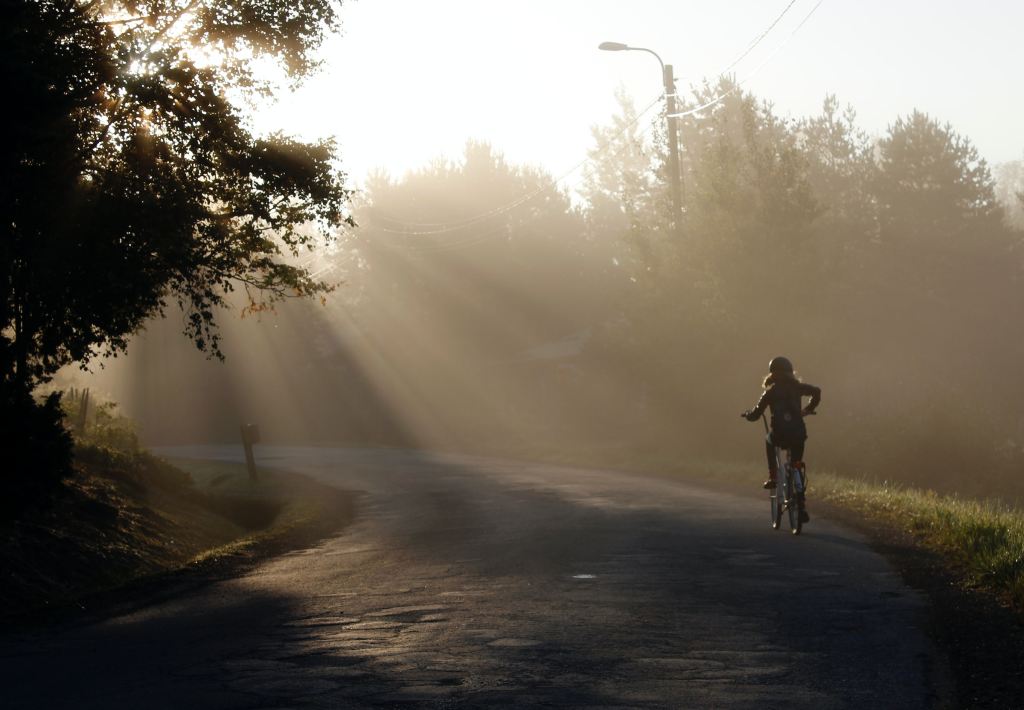 Girl riding a bike on a sunny afternoon. 